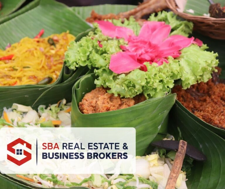 Colorful dishes in banana leaves with fresh ingredients.