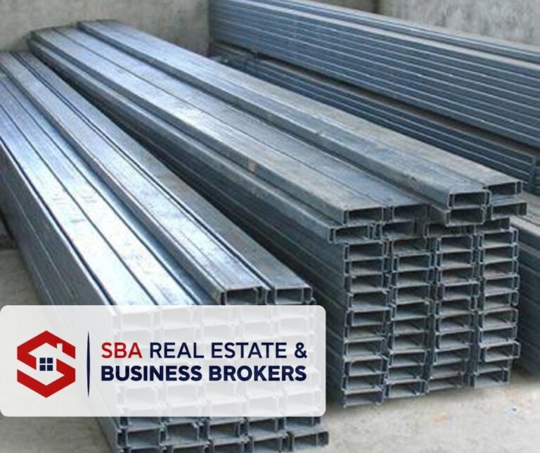 Stack of steel beams for construction projects.