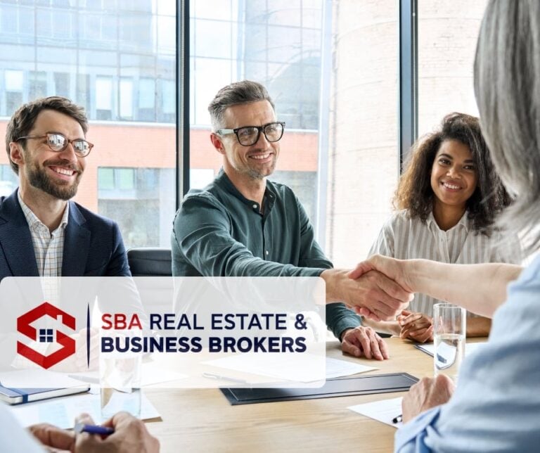 Business professionals engaged in a handshake agreement.