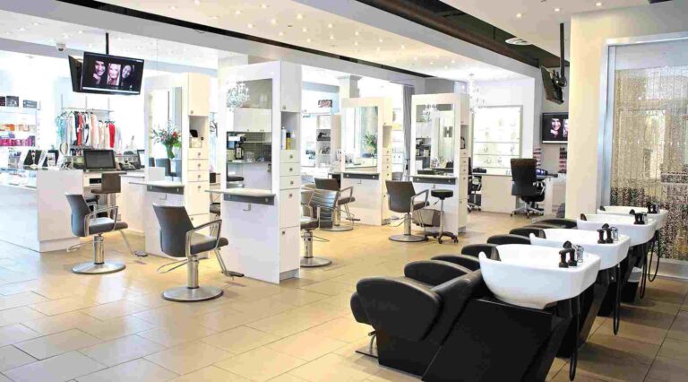 Modern hair salon with styling stations and washbasins
